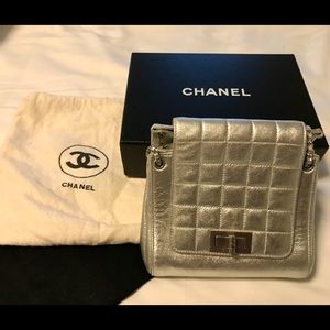 Chanel, mini accordion bag, silver, with silver chain.